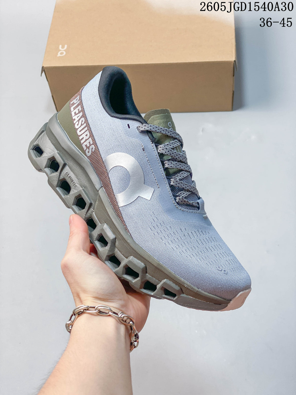 On Cloudmonster Void Low-Top Sneakers in Gray