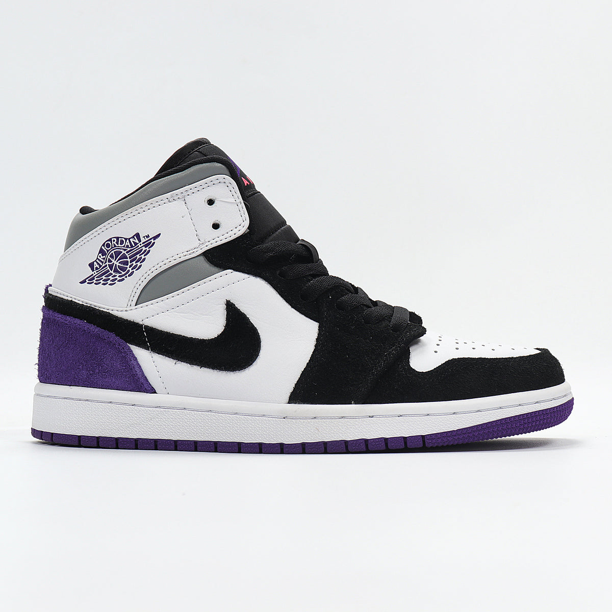 Opposite side profile showing the Jordan winged basketball logo, black laces, white panels, and purple outsole.