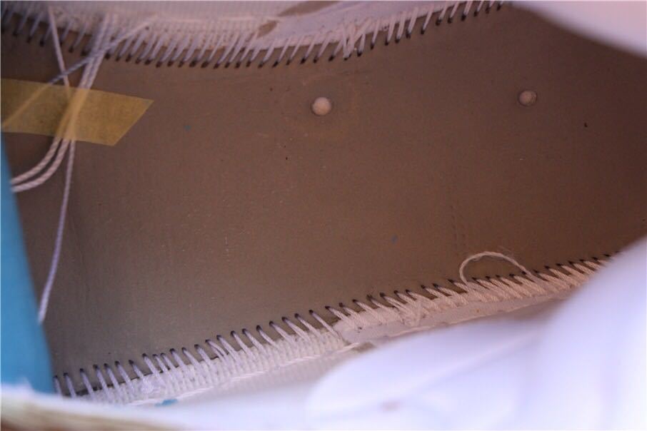Close-up of the interior lining and stitched construction.