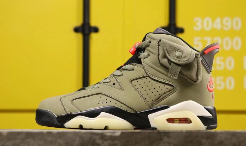 Side profile of the olive sneaker photographed against a yellow background, showing the high-top silhouette and translucent outsole.