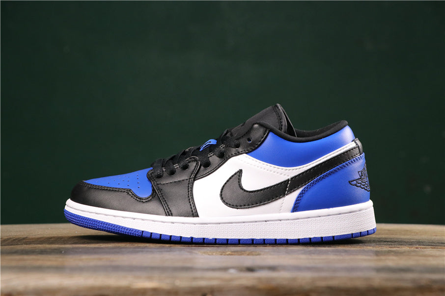 Side view of a royal blue, black, and white low-top sneaker with contrast panels, a side Swoosh-style mark, and a winged basketball emblem near the heel.