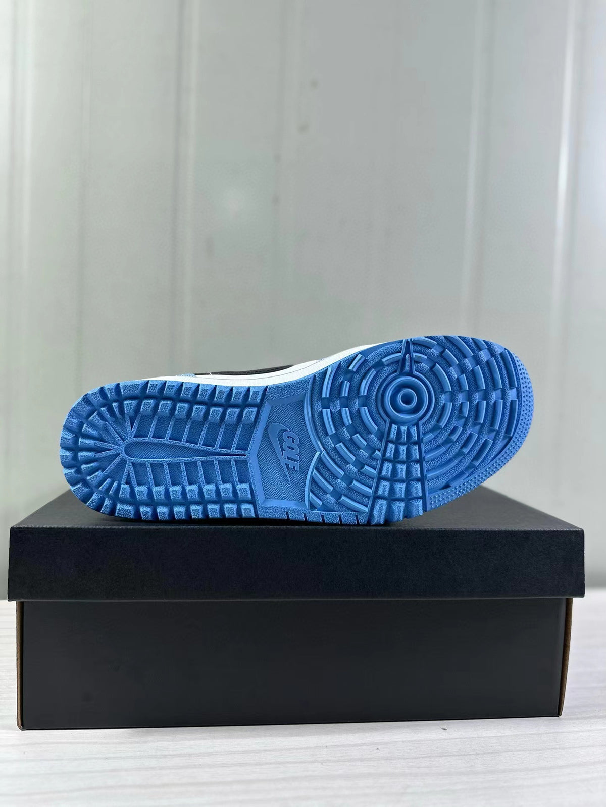 Underside view showing the blue patterned outsole.