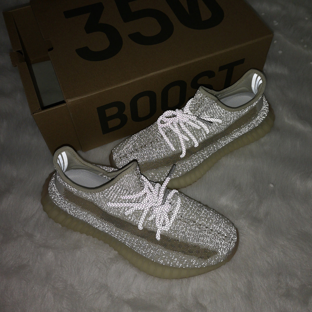 Flash-lit sneaker view with a Yeezy 350 shoebox, duplicated from image 5.