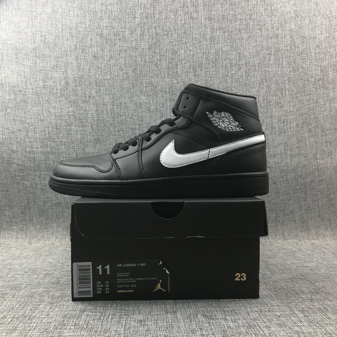 Side view of the sneaker above a box labeled Air Jordan 1 Mid; the box shows sample size EU 45, UK 10, CM 29 and US 11.