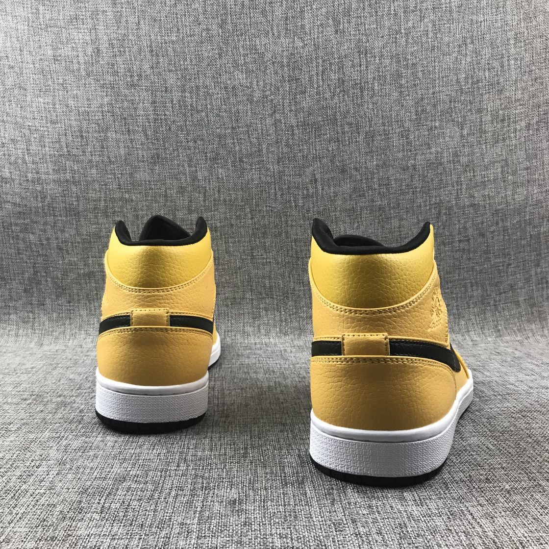Rear view of the pair showing yellow heel panels, black collar lining, and white midsoles.
