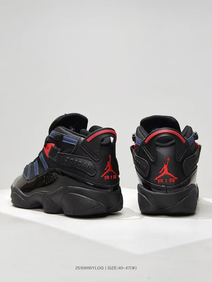 Rear view of black high-top sneakers with red Jordan branding and navy accents.