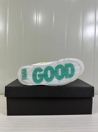 Bottom view of the sneaker showing a translucent outsole with large green lettering.