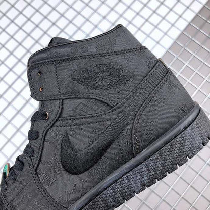 Close-up of the black sneaker side showing the tonal patterned upper, Swoosh, and ankle panel.