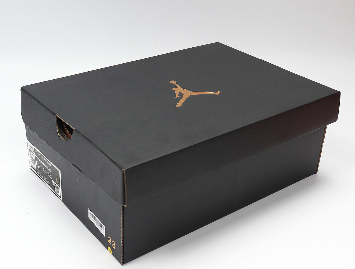 Black Jordan shoe box with a gold Jumpman logo and a visible size marking on the side.