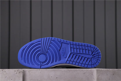 Blue rubber outsole with circular and segmented traction grooves.