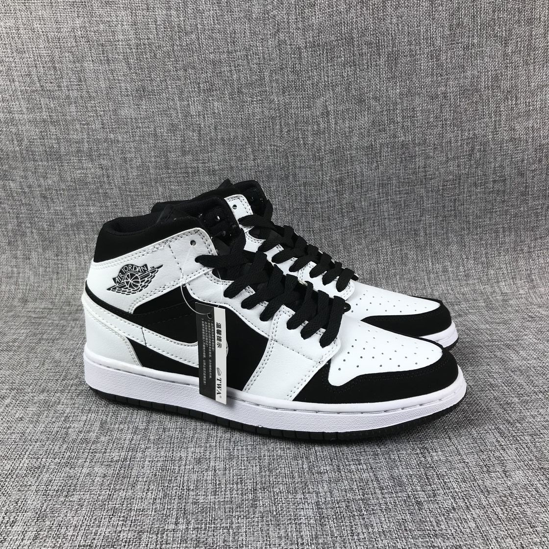 Pair of black-and-white high-top sneakers showing the ankle wings branding, black laces, and white midsoles.