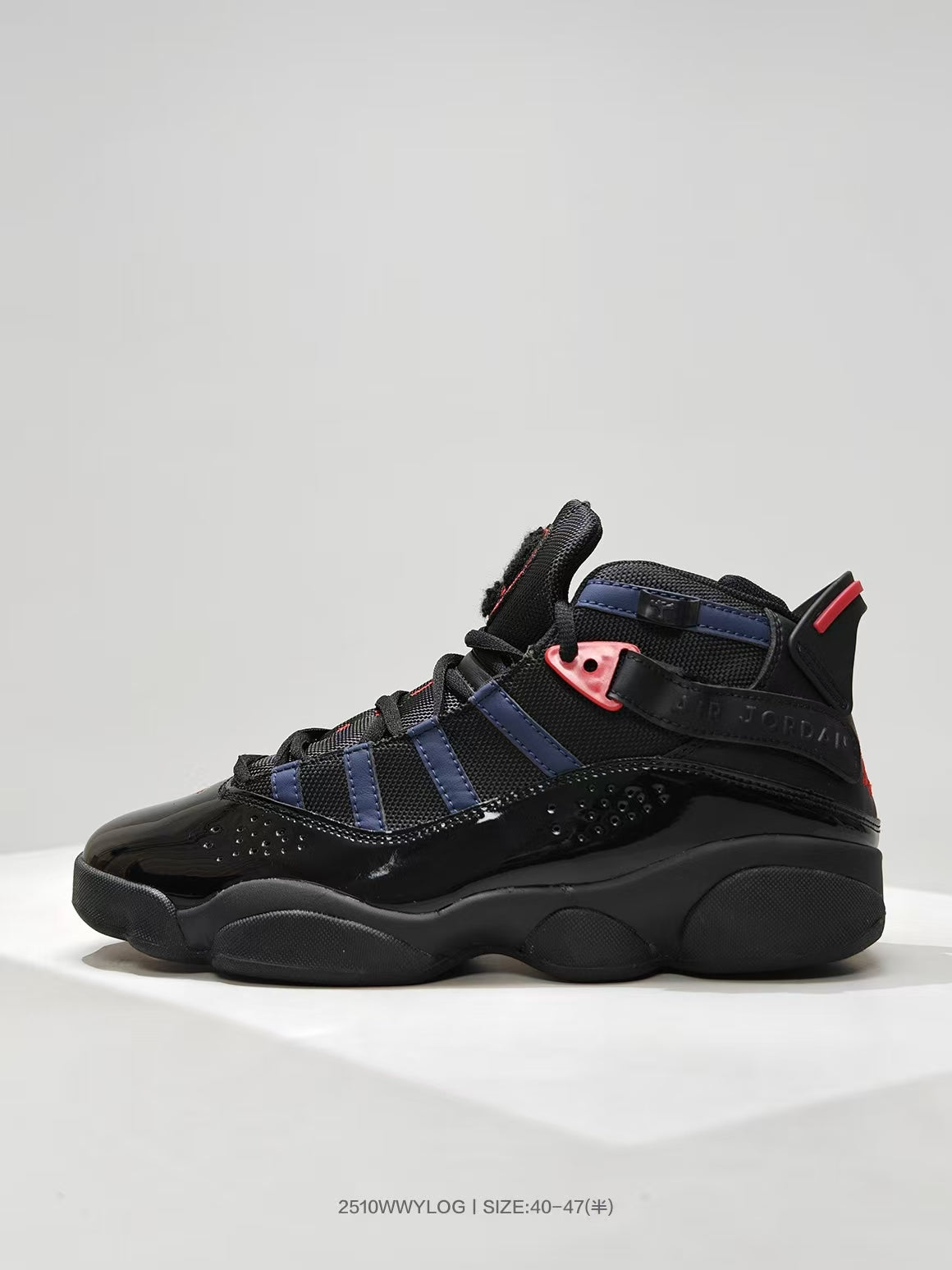 Side profile showing the high-top shape, layered navy panels, red accents, and black outsole.