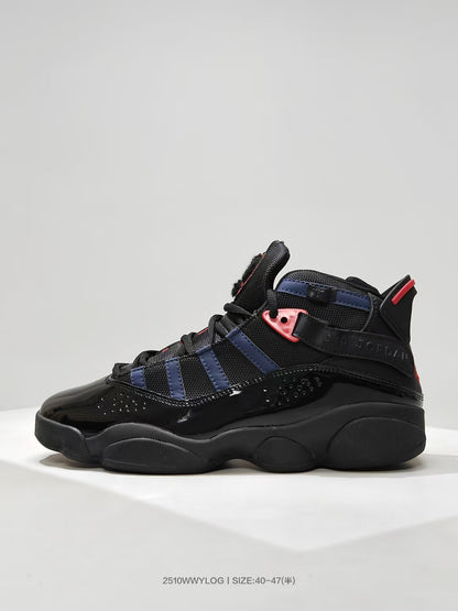 Side profile showing the high-top shape, layered navy panels, red accents, and black outsole.