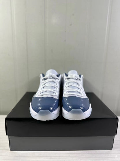 Front view of the pair of white and blue low-top sneakers
