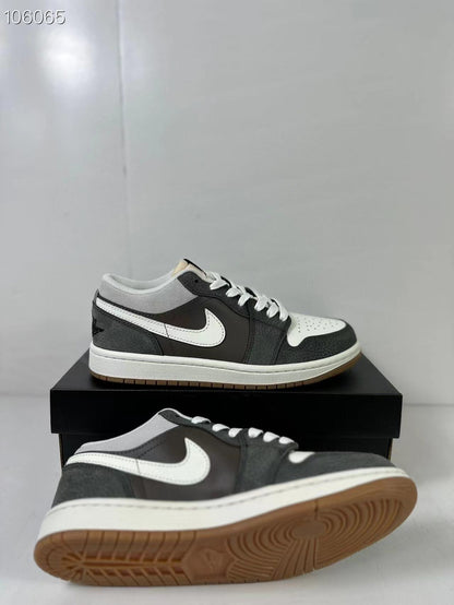 Two low-top sneakers shown from side and outsole angles, highlighting the perforated toe box and gum tread.