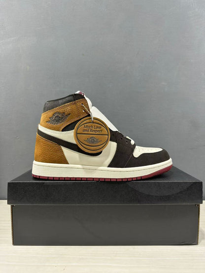 Side view of one high-top sneaker displaying the brown, black and white color blocking and burgundy outsole.