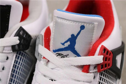 Close-up of a tongue label with blue Jumpman branding and red collar lining.