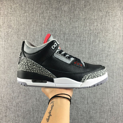 Air Jordan 3 Black Cement sneaker shown from the side above its shoebox; box label visible