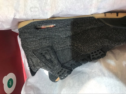 Close-up of the black denim-style upper, black outsole edge and visible air unit.
