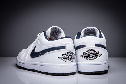 Rear view of the pair showing the Air Jordan winged-ball heel logos and dark outsole edges.