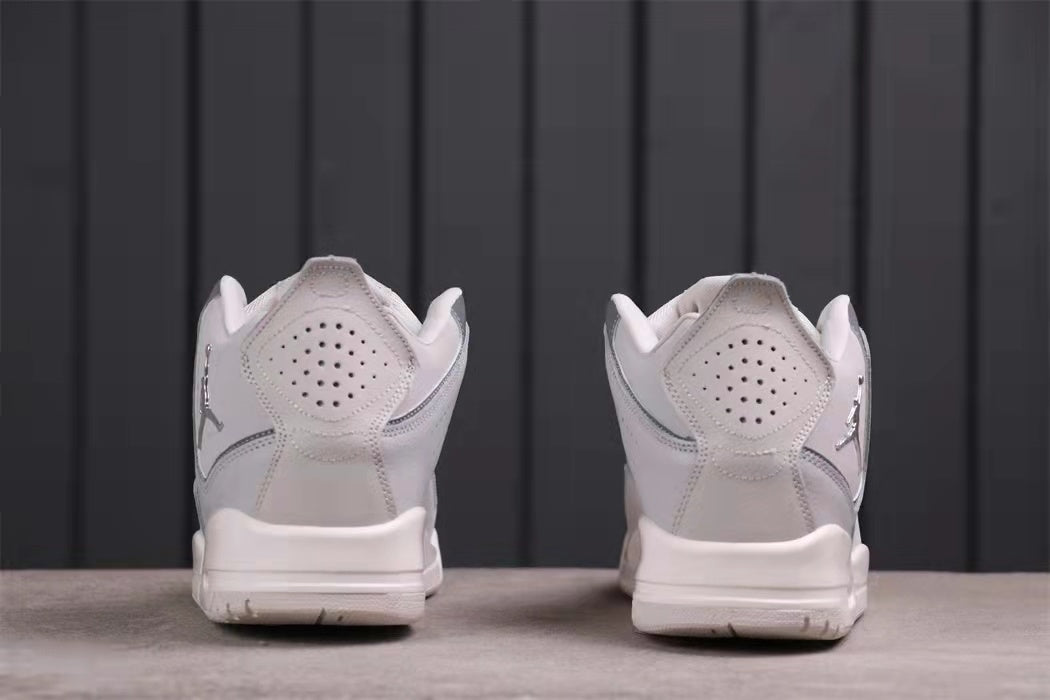 Rear view showing padded collars, perforated heel panels, and outsole edges.