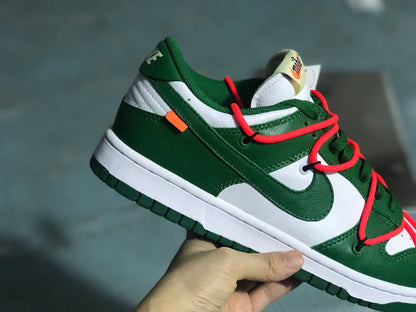 Angled heel-side view showing the layered green and white upper and orange accent tab.
