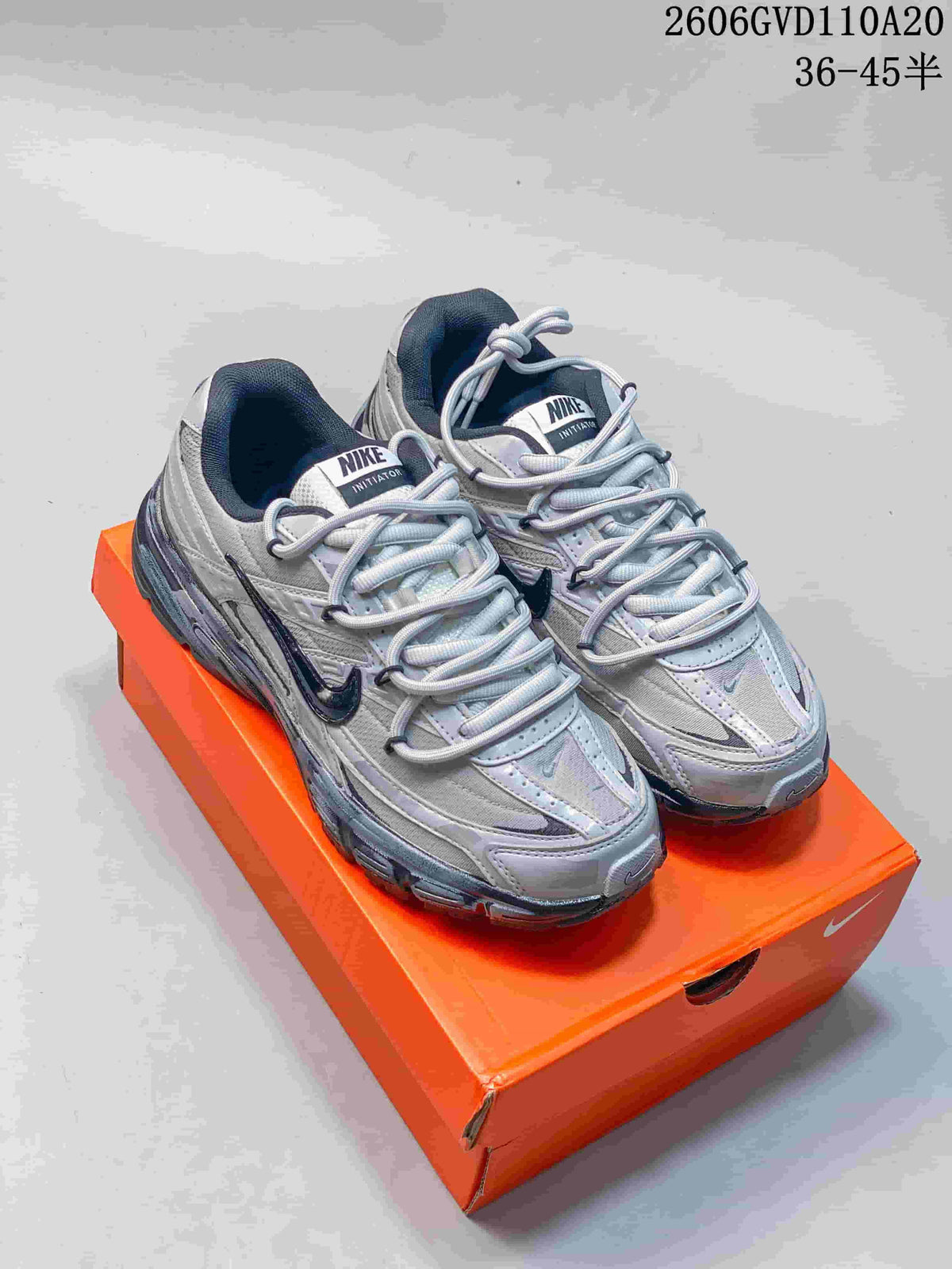 Nike Initiator Low-Top Sneakers in Silver and Black