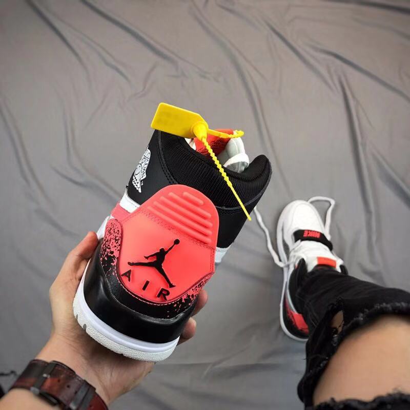 Rear view showing the red and black heel area with a Jumpman graphic and contrasting panel details.