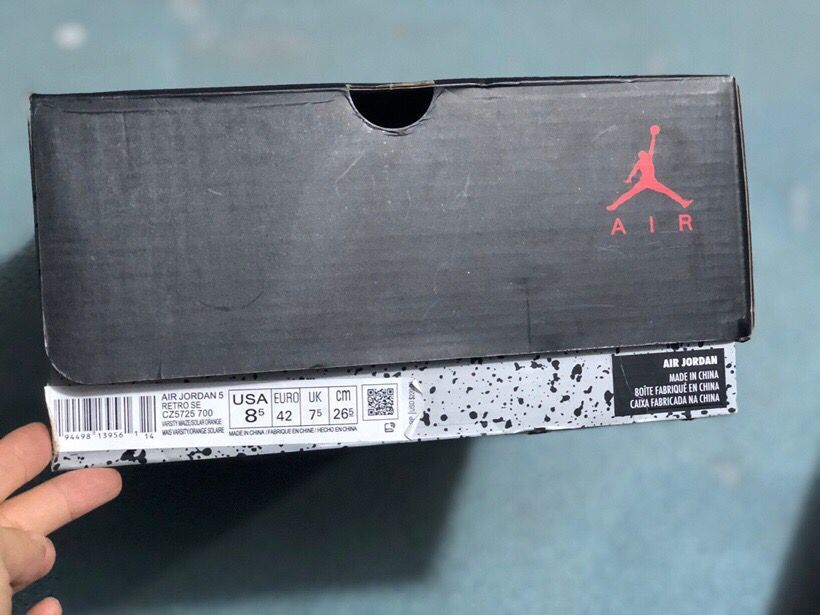 Black Jordan shoebox with a visible label identifying Air Jordan Retro 5 and EU size 42.