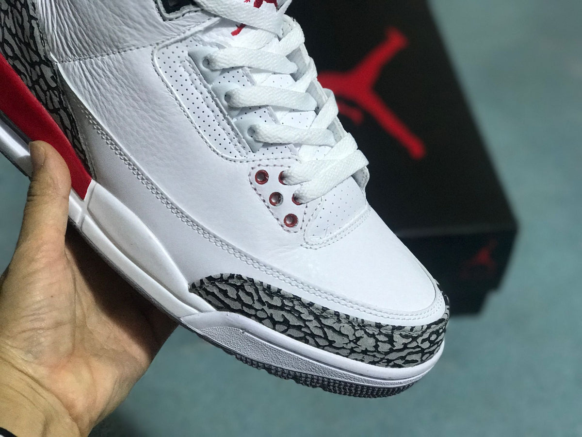 Close-up of the elephant-print toe overlay and white lacing on a Jordan 3 Retro sneaker