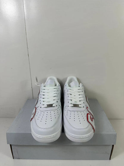 Front view of the pair showing perforated toe boxes, white laces and red-outlined side lettering.