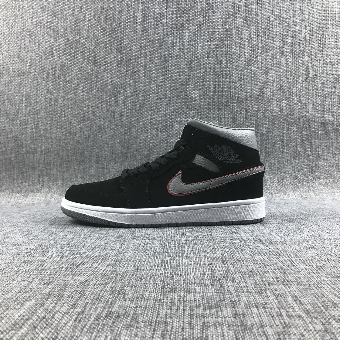 Side profile showing the black high-top upper, grey Swoosh, white midsole and grey outsole.