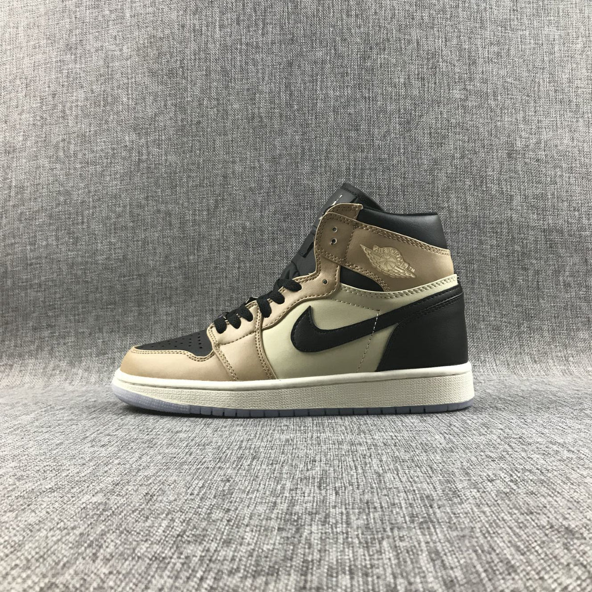 Side profile of the beige and black high-top sneaker showing the Swoosh and layered collar.