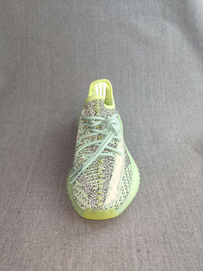 Top-front view showing the knit-patterned upper, laces, and rounded toe.
