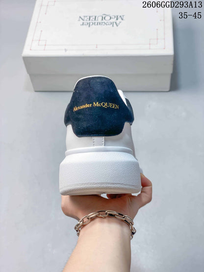 Alexander McQueen White Low-Top Sneakers with Black Heel Tab