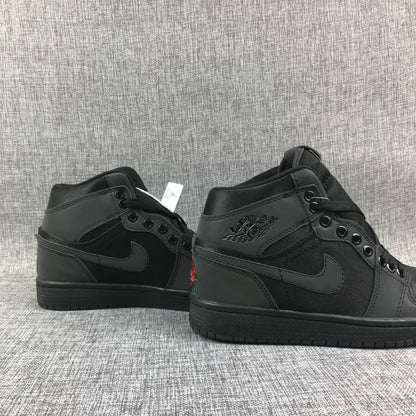 Pair of black high-top sneakers shown from the rear-side angle with rose embroidery partially visible.
