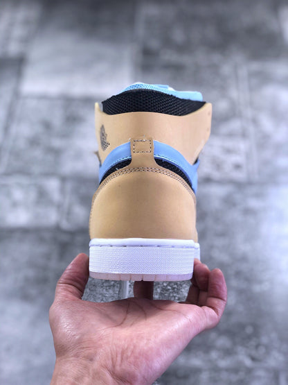 Rear view of the tan and light blue high-top sneaker showing the heel panel, collar, and white outsole.