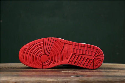 Underside view showing the red rubber outsole tread pattern.