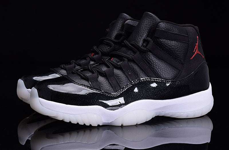 Front three-quarter view of a pair of black high-top sneakers with glossy forefoot panels and white soles.