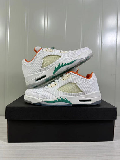 Stacked view of the pair highlighting the white upper, translucent side panels, and green midsole accents.