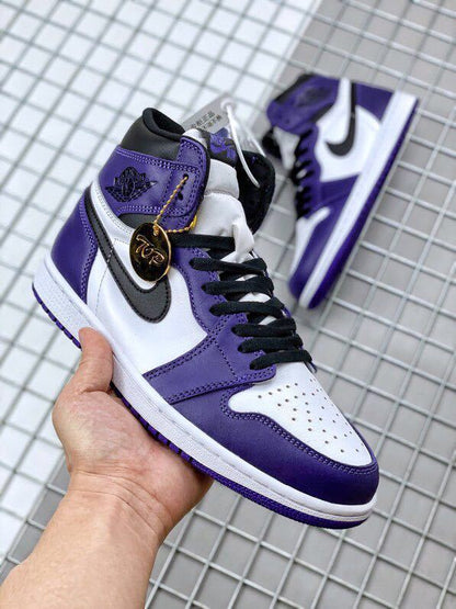 Close-up of the sneaker with its gold hangtag and a second shoe in the background.
