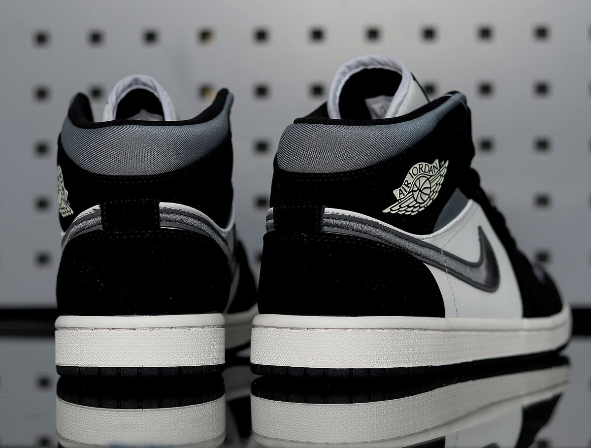 Rear three-quarter view showing the padded collars, ankle logos and white midsoles.