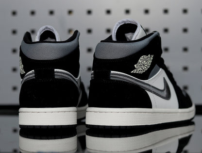 Rear three-quarter view showing the padded collars, ankle logos and white midsoles.