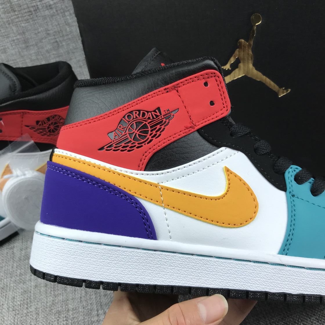 Close-up of the red collar, yellow side branding panel, white side panel and purple heel.