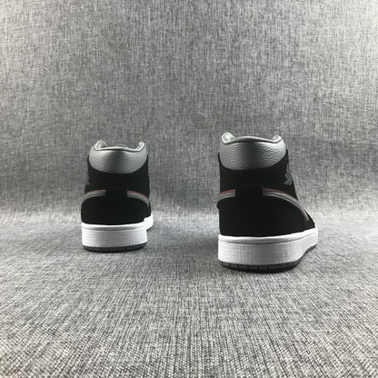 Rear view of both sneakers showing the black heel panels, grey collars and white midsoles.