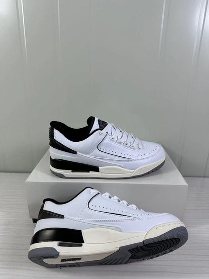 Angled side view showing the white upper, black heel accents, layered midsole, and gray outsole.