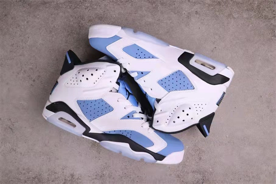 Jordan 6 sneakers arranged to show the outer side panels, heel structures, and translucent outsole sections.