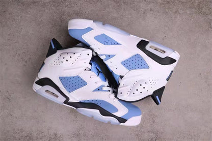 Jordan 6 sneakers arranged to show the outer side panels, heel structures, and translucent outsole sections.