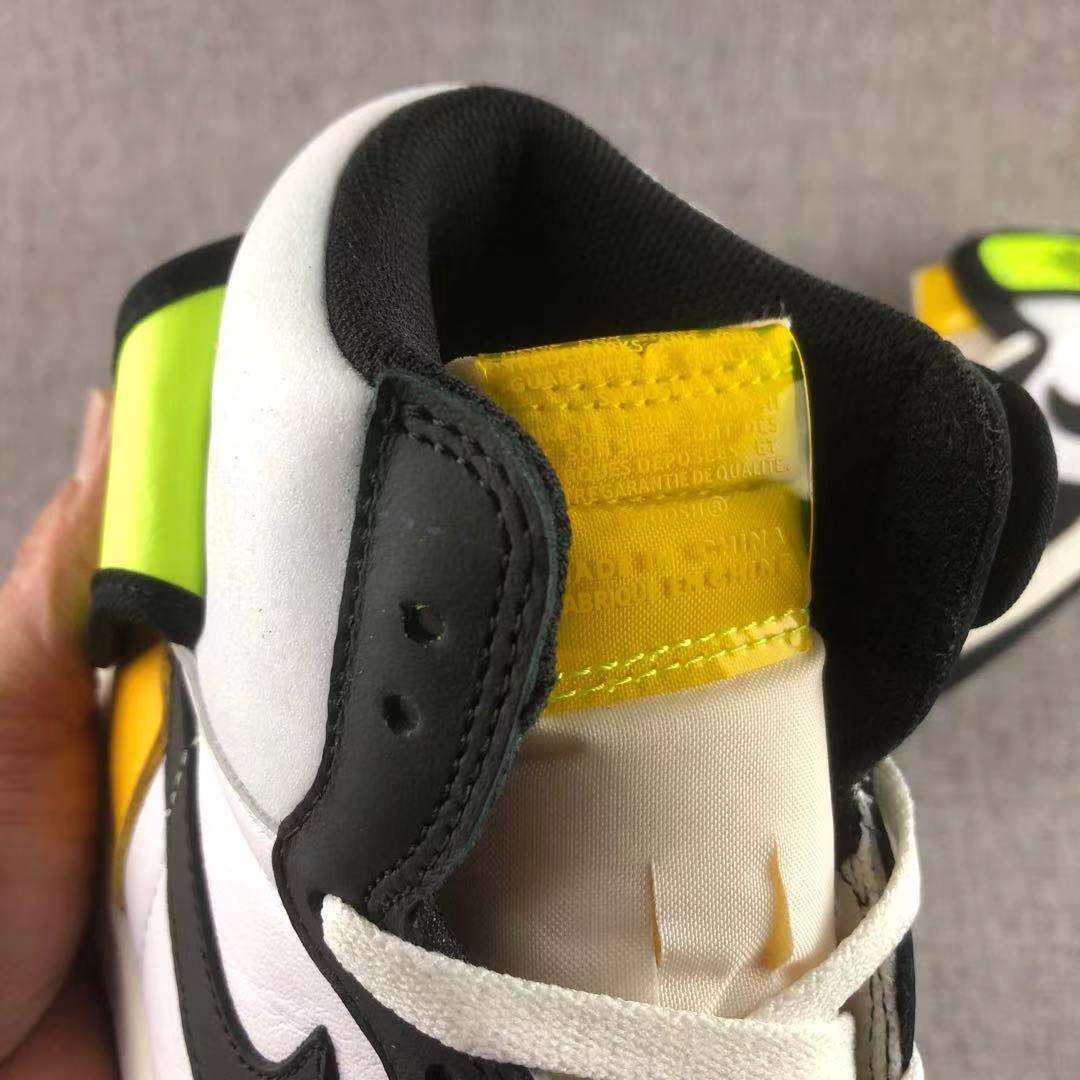 Close-up view of the padded collar, tongue and interior branding on the sneaker.