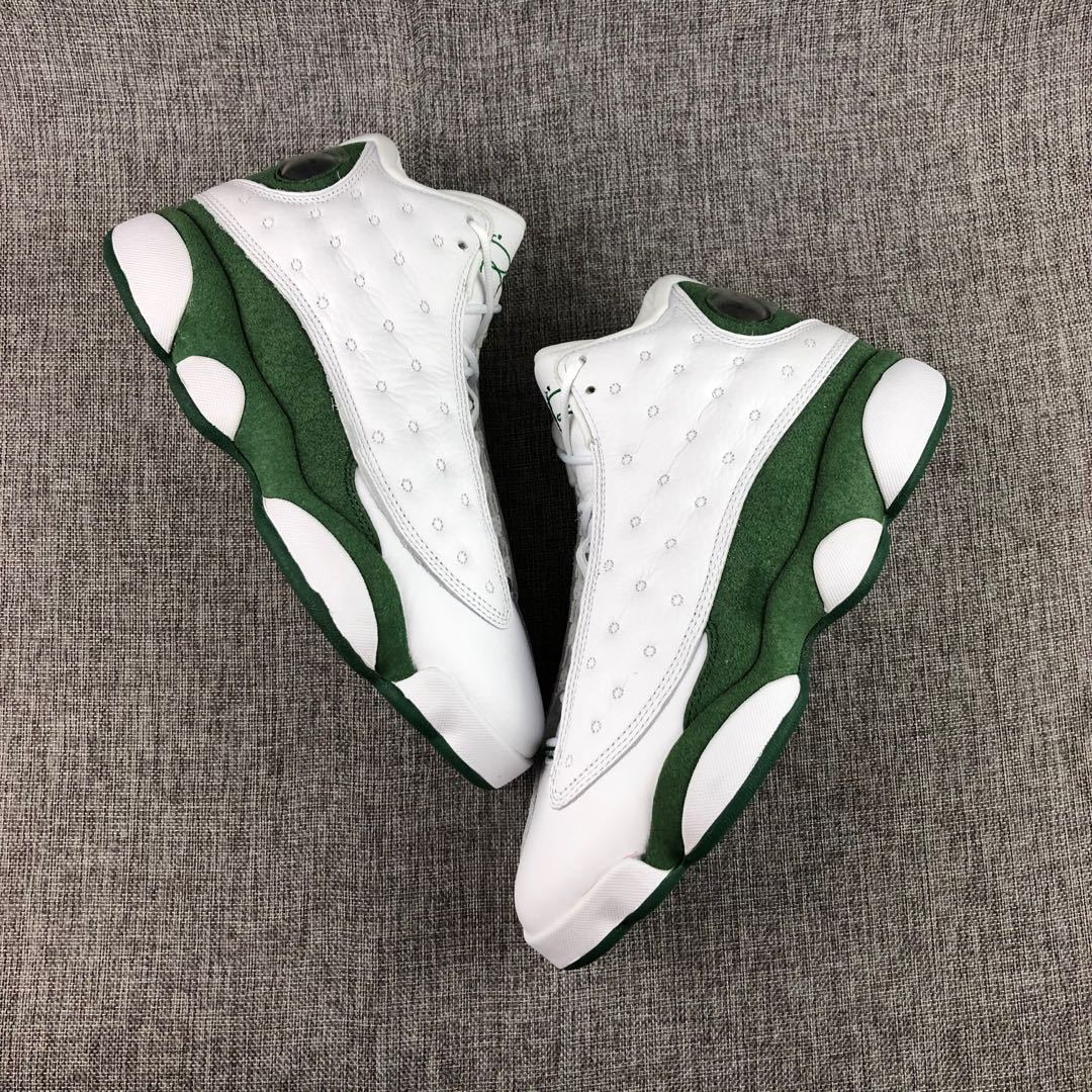 Top and side view of the white and green high-top sneakers with textured white panels and green midsoles.